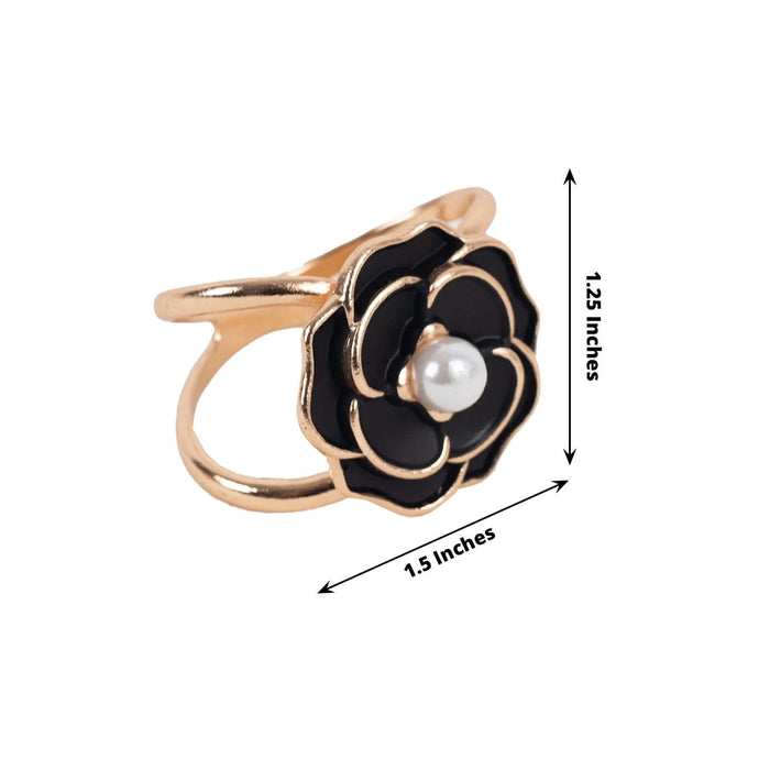 Gold flower ring with black enamel and pearl, dimensions 1.5x1.25 inches.
