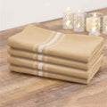 Set of four beige kitchen towels with white stripes.