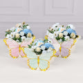 Colorful butterfly-shaped flower arrangements in pastel colors.
