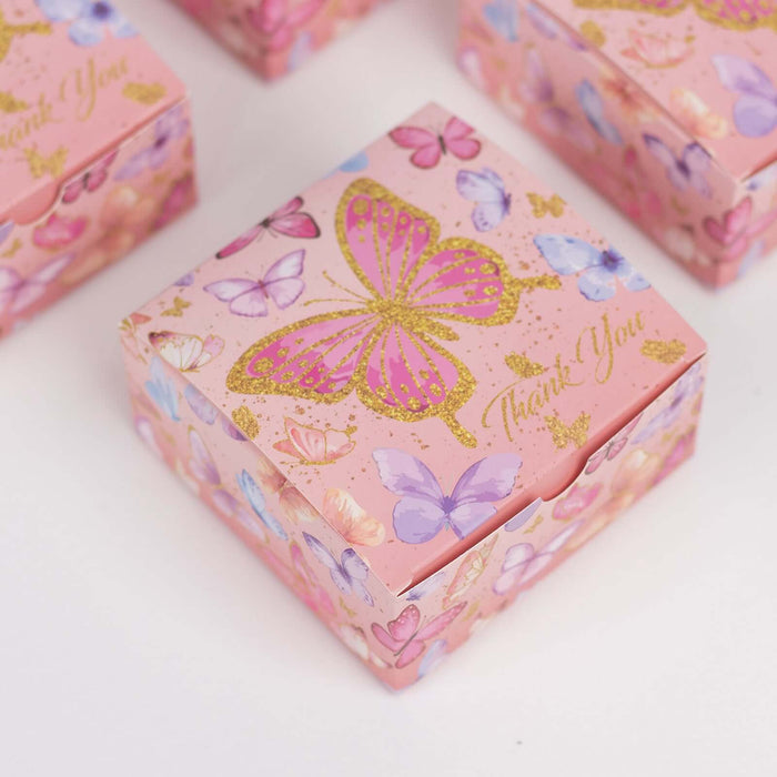 Pink butterfly thank you gift box with gold accents and colorful floral designs.