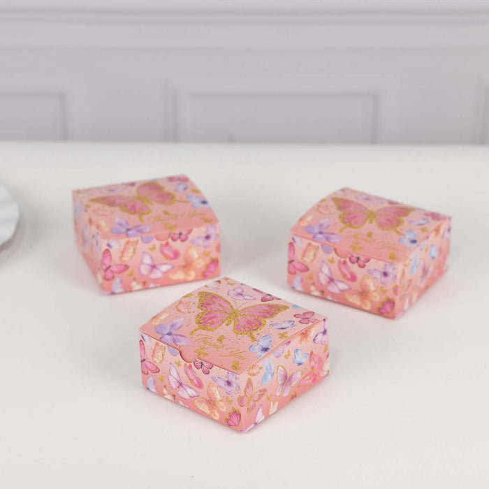 Decorative pink gift boxes with butterfly designs on a white background.