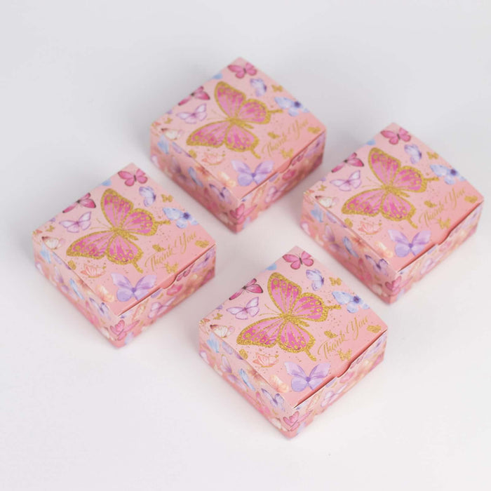 Colorful butterfly-themed gift boxes stacked together.