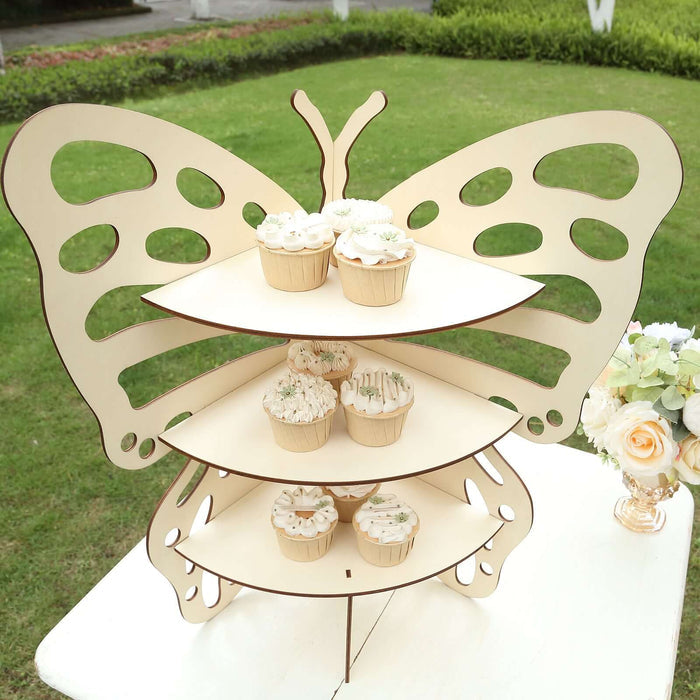 Butterfly-shaped cupcake stand with three tiers, holding decorated cupcakes.