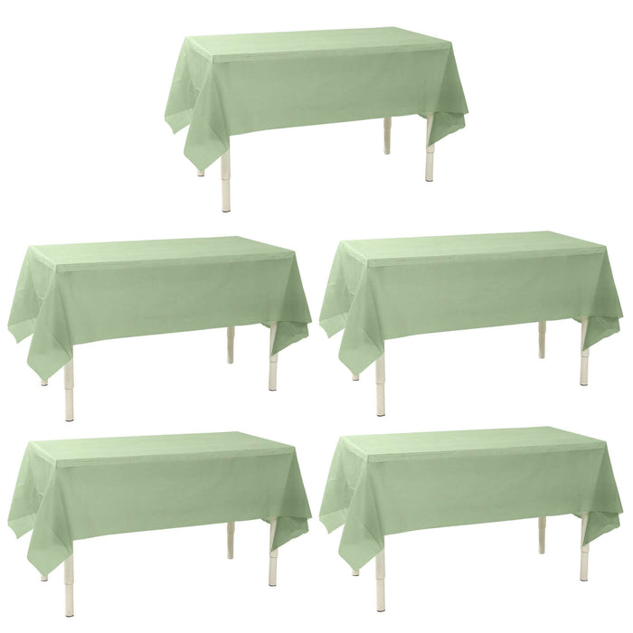 Set of five green tablecloths on rectangular tables