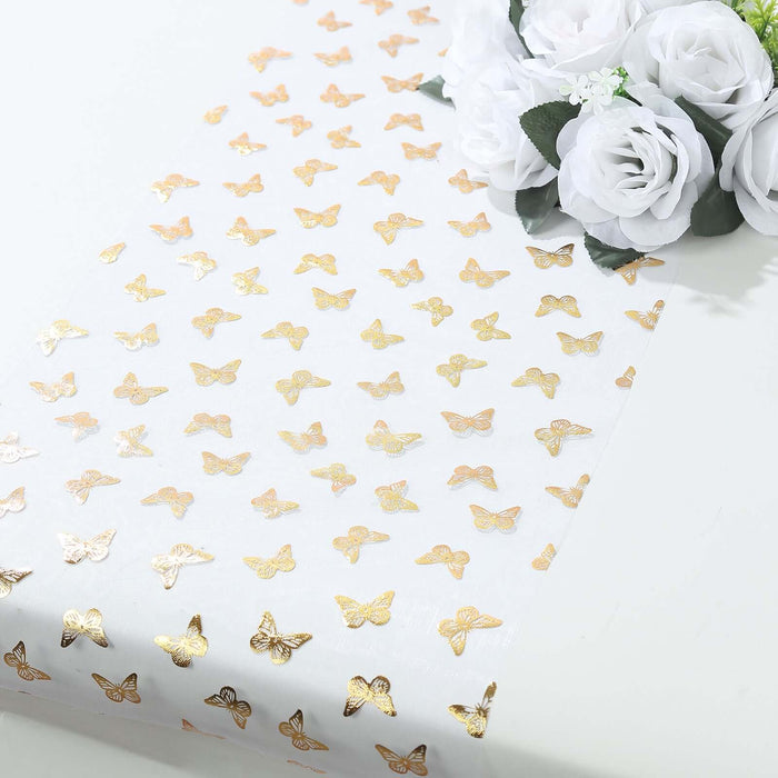 Gold butterfly patterned table runner on a white background.