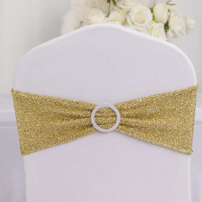 Gold glitter chair sash with rhinestone buckle for elegant decor.