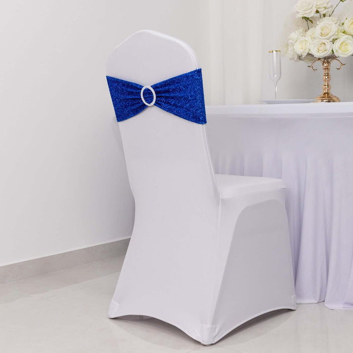 White chair with blue sequin bow, perfect for event decor.