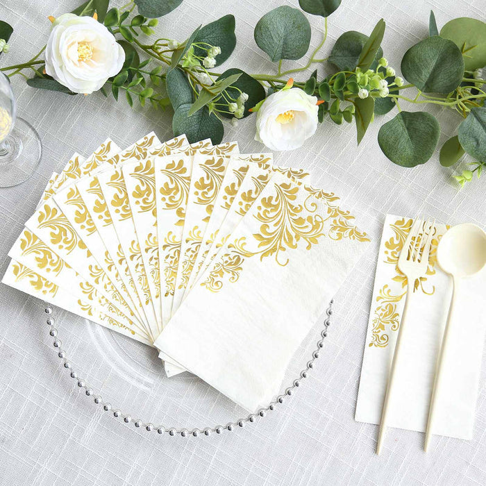 Elegant gold-accented napkins with utensils for stylish dining.