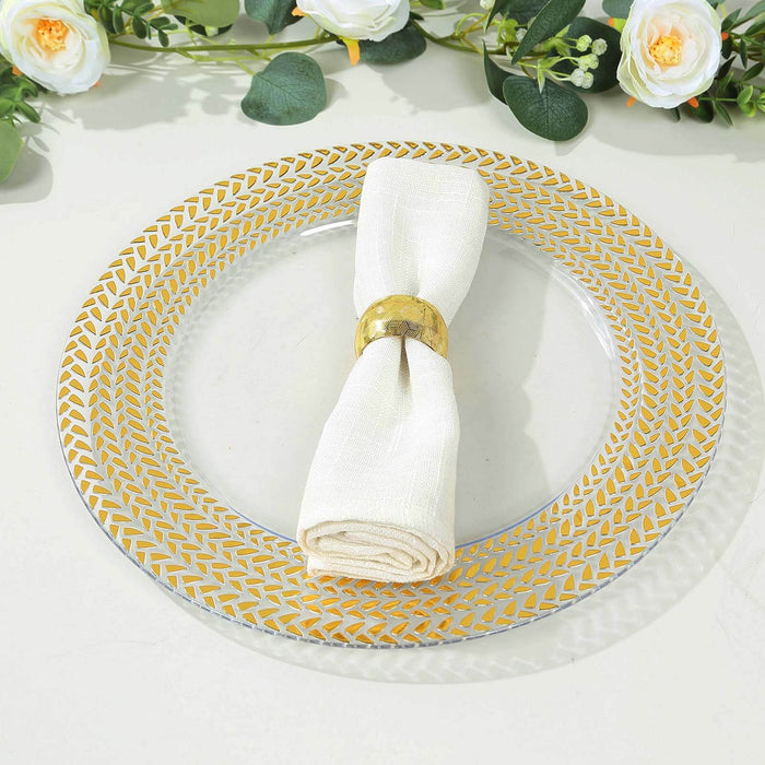 Elegant round plate with gold geometric pattern and white napkin.