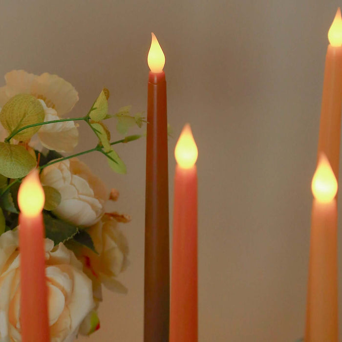 Colorful decorative candles with a floral arrangement