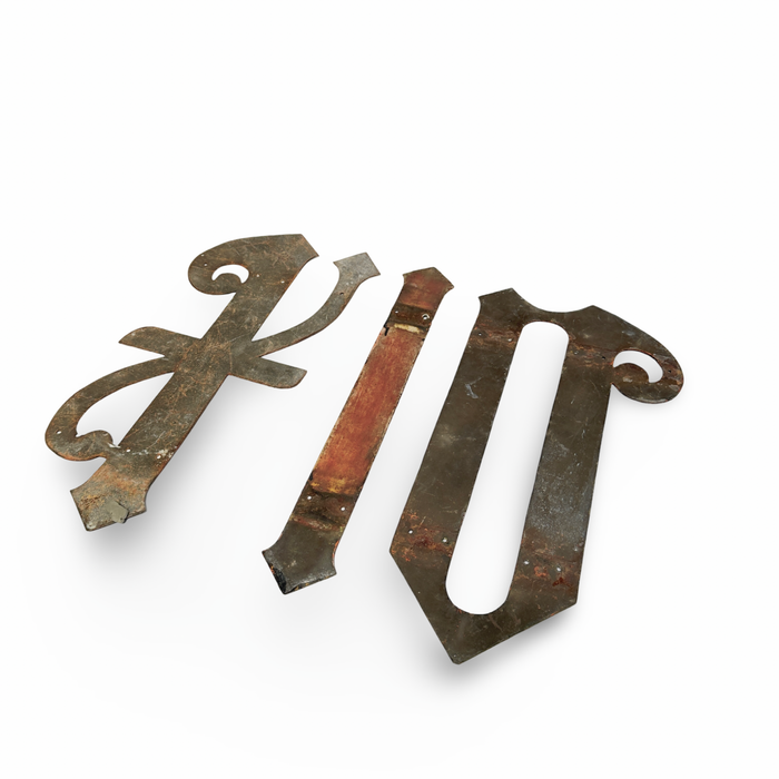 Antique ecclesiastical letter ornament, distressed brown and green metal, multi-letter design