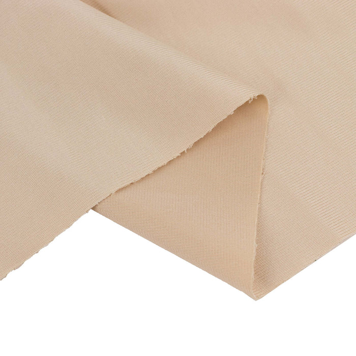 Beige textured fabric corner on a plain background.
