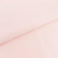 Light pink fabric with a smooth texture and folded edges.