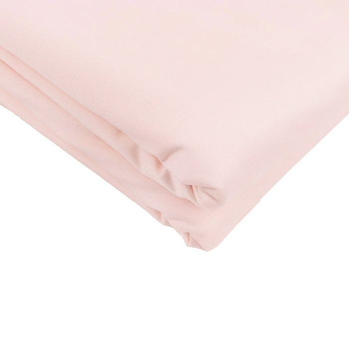 Pink fabric roll on a white background