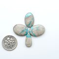 Carico Lake Turquoise cabochons with vibrant aqua-blue to turquoise tones and natural matrix, ideal for rings, pendants, and artisan jewelry.