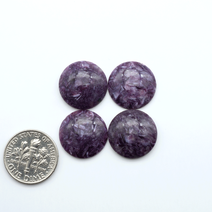 Shop natural Charoite cabochons with vivid violet swirls, perfect for jewelry makers and silversmiths creating rings, pendants, and custom designs.