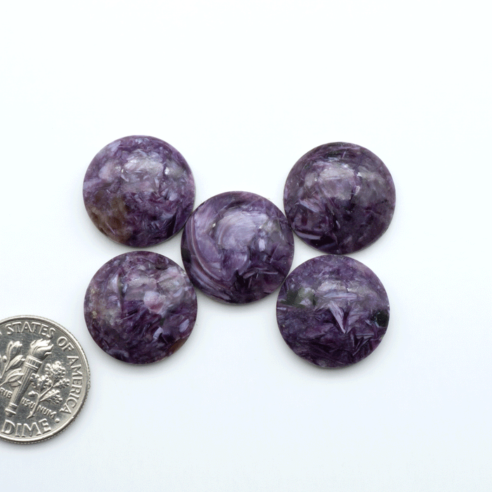 Shop natural Charoite cabochons with vivid violet swirls, perfect for jewelry makers and silversmiths creating rings, pendants, and custom designs.