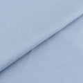 Light blue textured fabric with subtle diagonal stripes.