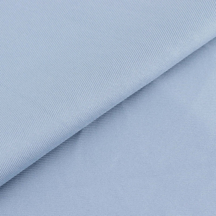 Light blue textured fabric with subtle diagonal stripes.