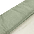 Green textured fabric roll on a white background.