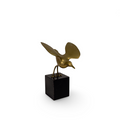 Brass sparrow ornament on a dark square base stand