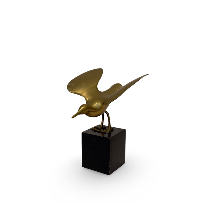 Brass sparrow sculpture with wings spread on dark square base