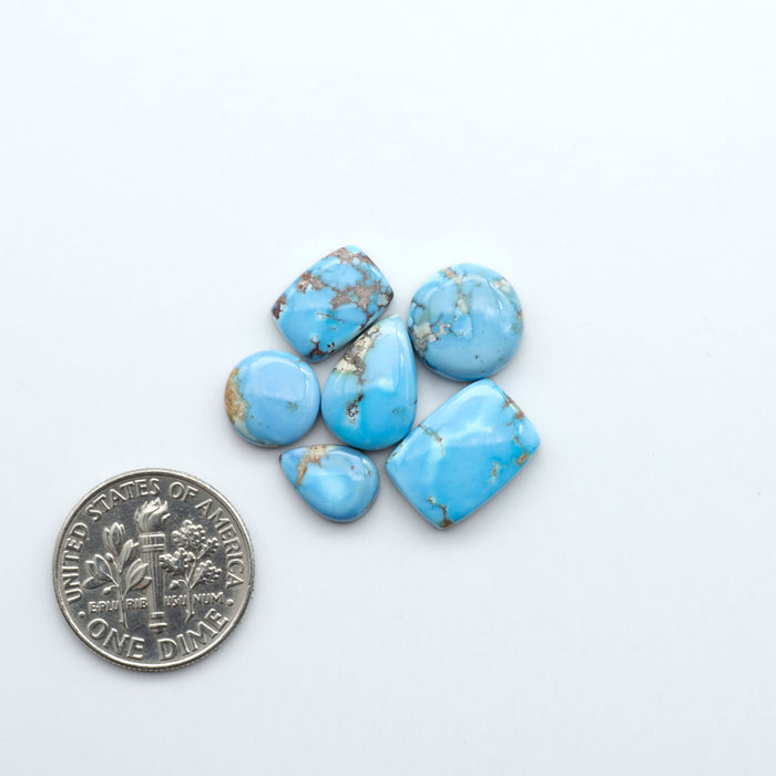Discover the beauty of Natural Golden Hills Turquoise—prized for its icy blue tones, golden matrix, and exceptional quality. Ideal for artisan jewelry designs.