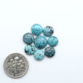 Hubei Cloud Mountain Turquoise cabochons, blue and green color with black matrix, polished stones on a white background with a US dime for scale