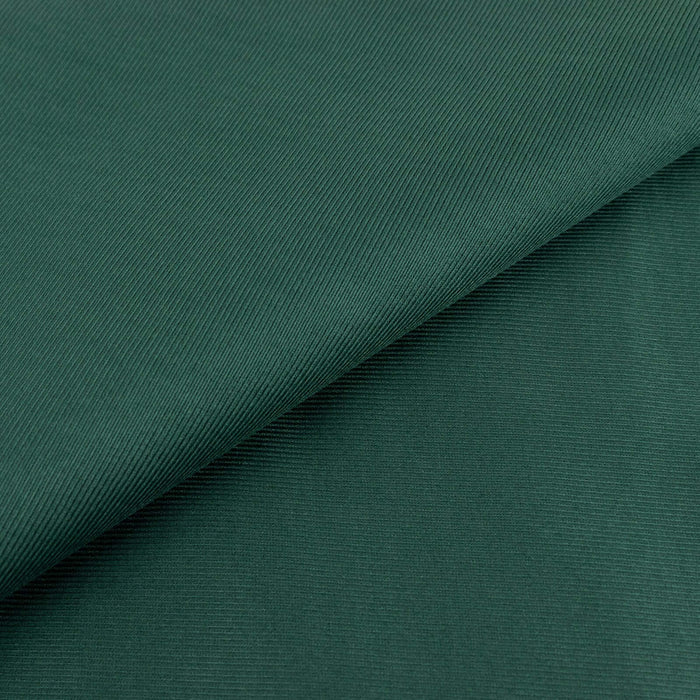 Green textured fabric with subtle ribbing detail.