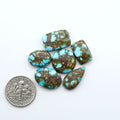 Kingman Red Web Turquoise Kingman Turquoise Cabochons are a staple in the jewelry industry, known for their stunning blue-gre