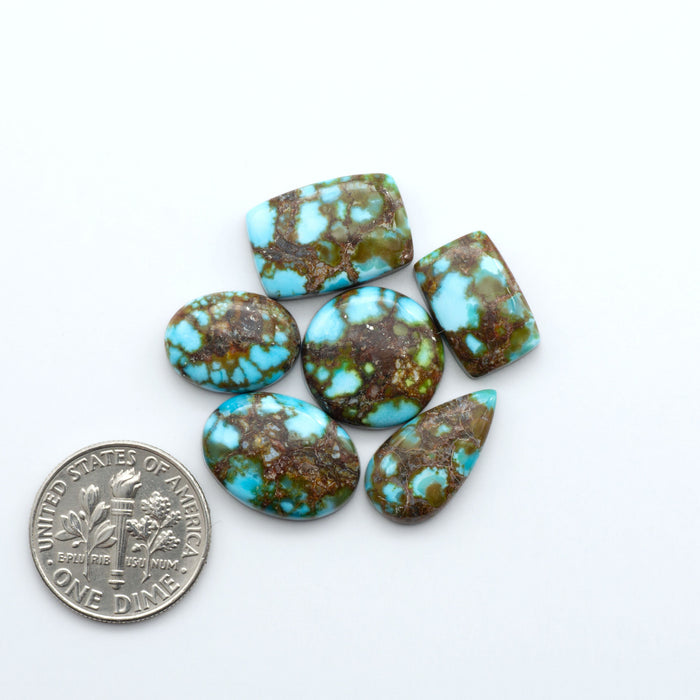Kingman Red Web Turquoise Kingman Turquoise Cabochons are a staple in the jewelry industry, known for their stunning blue-gre
