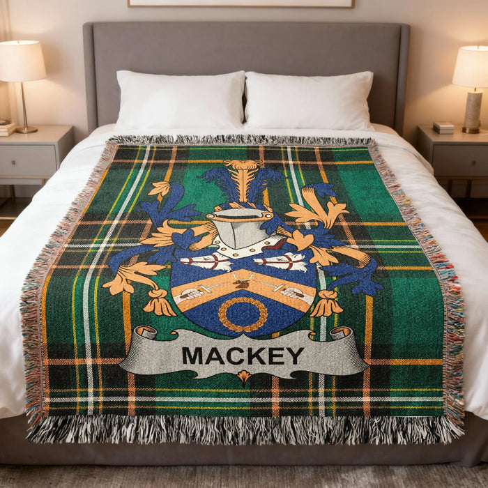 Mackey family crest Irish National Tartan woven blanket displayed on a bed.