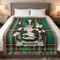 Madden family crest Irish National Tartan woven blanket displayed on a bed.