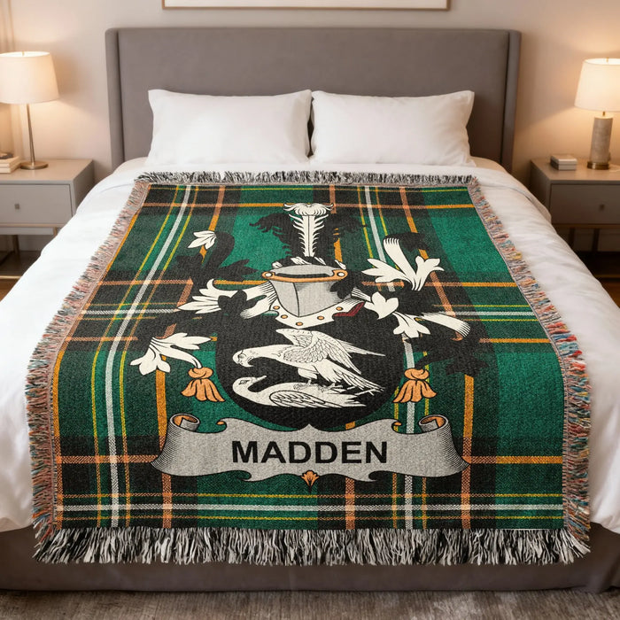 Madden family crest Irish National Tartan woven blanket displayed on a bed.