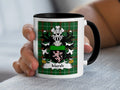Mug with the Marsh family crest on a green plaid background.
