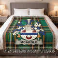 McArdle tartan blanket featuring a family crest with blue, white, and red elements.