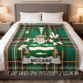 McCabe family crest Irish National Tartan woven blanket displayed on a bed.