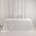 White tablecloth draped over a table against a light background.