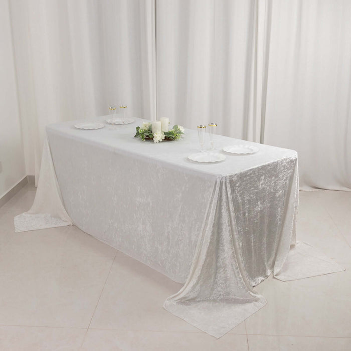 Elegant white tablecloth draped over a table, styled for a dining setting.