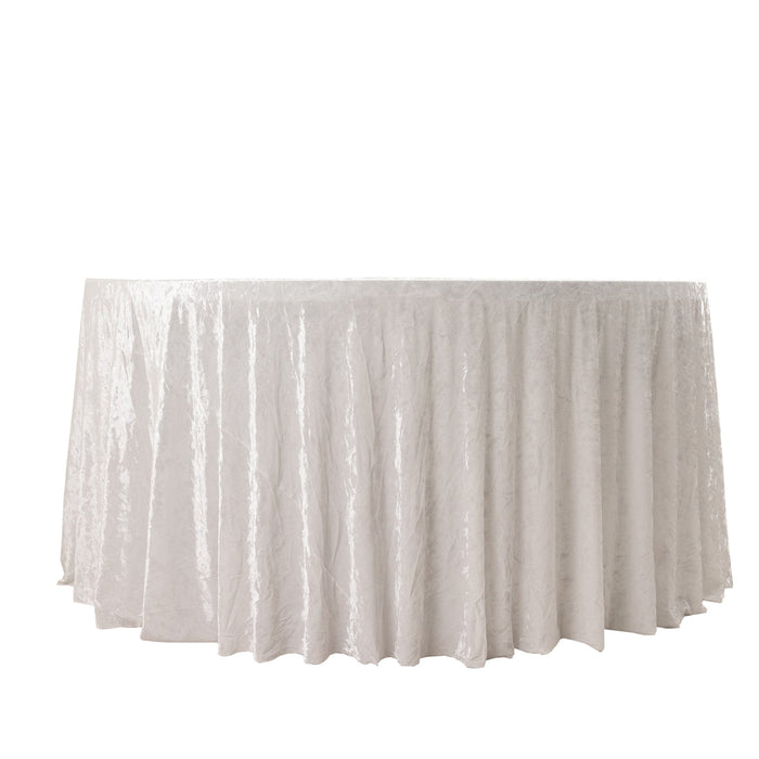 White tablecloth with a textured finish, draped elegantly over a round table.