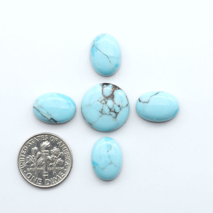 Enhance your jewelry designs with Pressed Turquoise Nugget Cabochons. Crafted from composite materials they add a captivating touch to your creations.