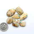 Royston Turquoise cabochons are famous for their distinctive matrix and unique green and blue hues, making them a favored option among jewelry designers.