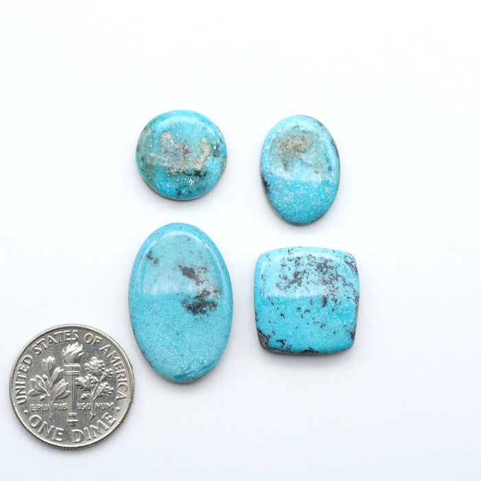 Royston Turquoise cabochons are famous for their distinctive matrix and unique green and blue hues, making them a favored option among jewelry designers.