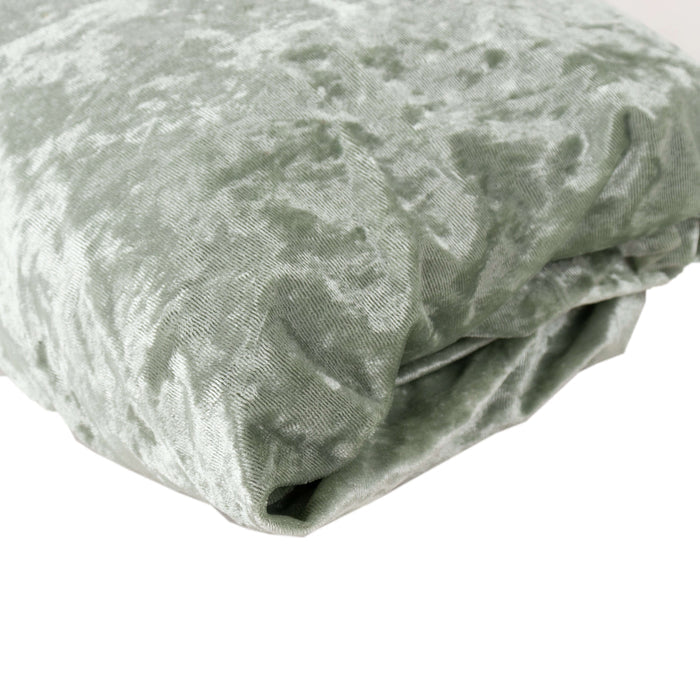Soft green velvet throw blanket folded neatly
