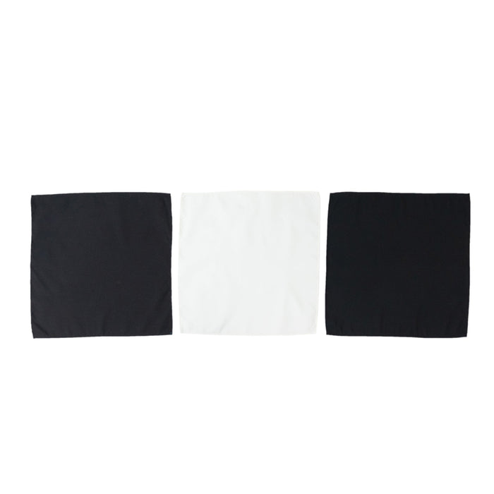 Set of three fabric squares in black, white, and gray on a white background.