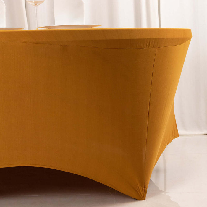 Yellow tablecloth draped over a round table.