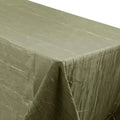 Olive green textured tablecloth on a plain background