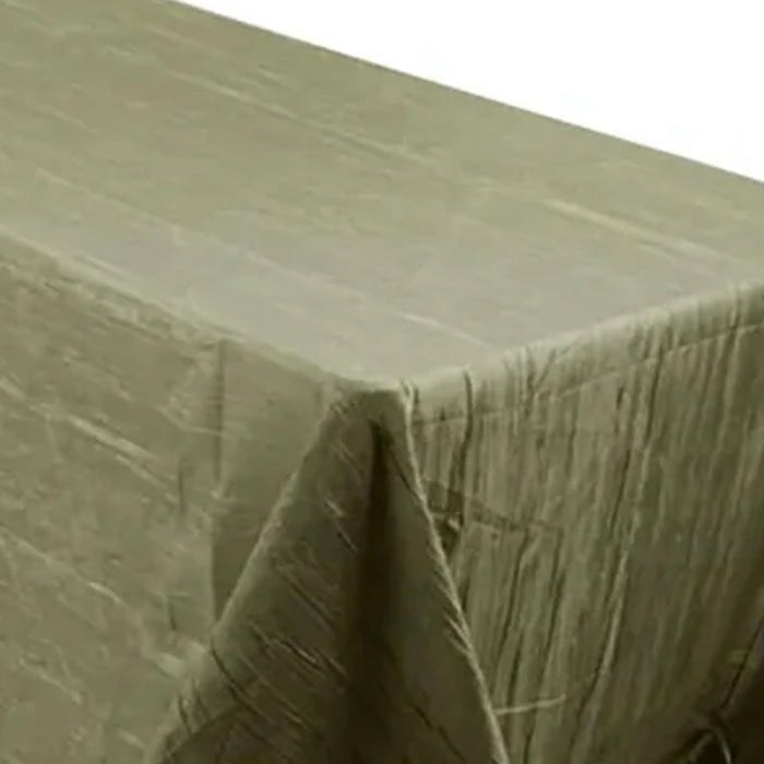Olive green textured tablecloth on a plain background