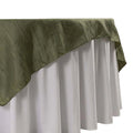 Olive green tablecloth with white underlayer, elegantly draped.