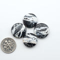 Natural White Buffalo Stone Cabochons are semi-precious gemstones cut into shapes ideal for jewelry-making, making them an excellent choice for artisans.